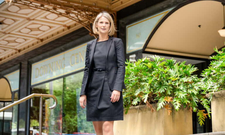 Helen Roebuck standing on the steps outside of the Sydney Downing Centre Supreme Court building