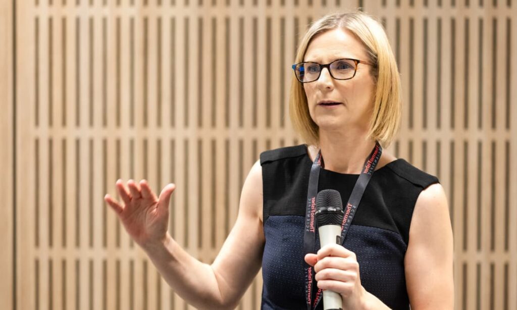 Helen Roebuck DNA expert witness giving evidence whilst standing with microphone in hand